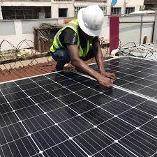 Solar engineers aligning photovoltaic panels